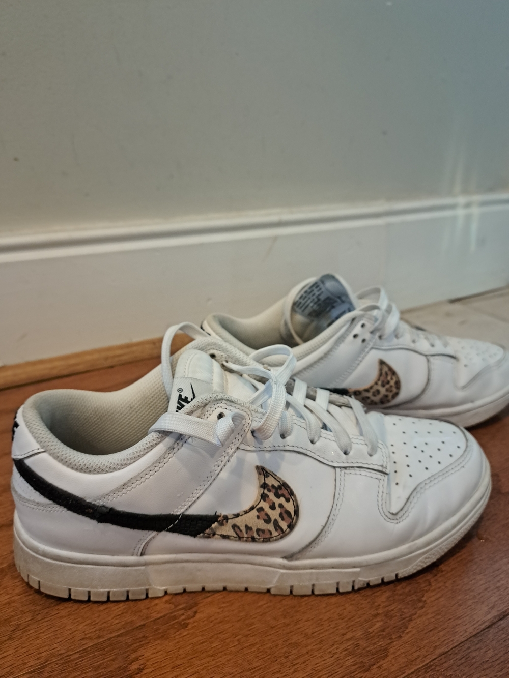 Nike White Interior Low-Top Sneaker with Black Swoosh Detail